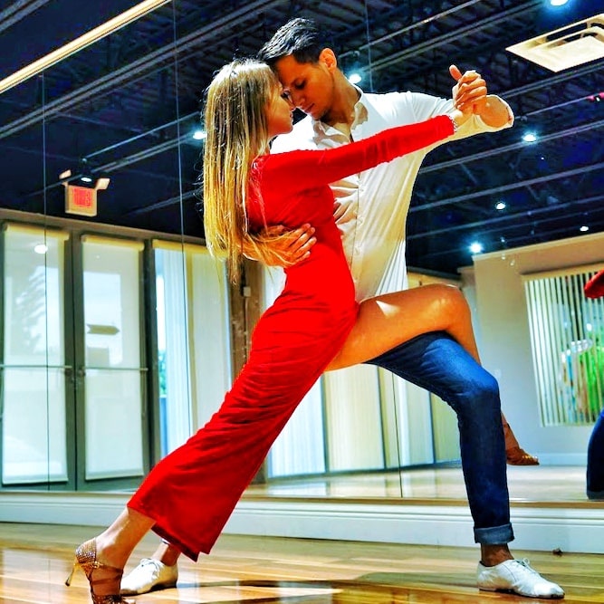 Dancing pose in a red dress at the studio